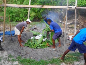 Laying the food on the burning ashes and rocks